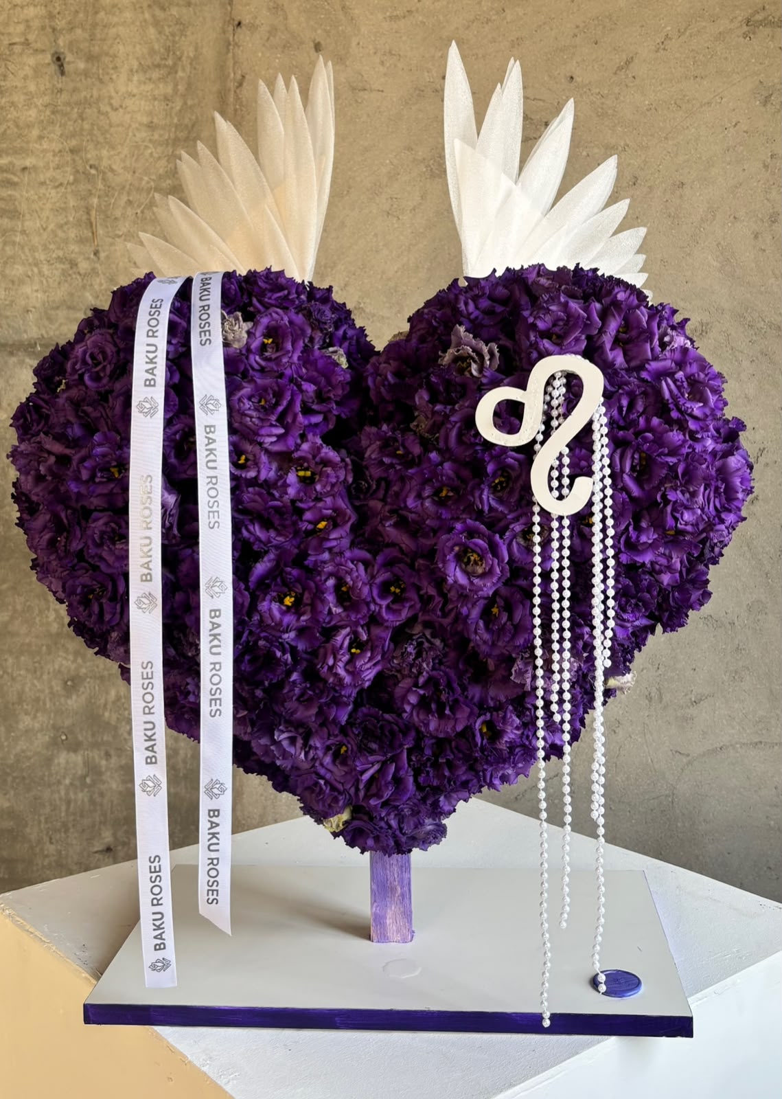 Purple heart with wing